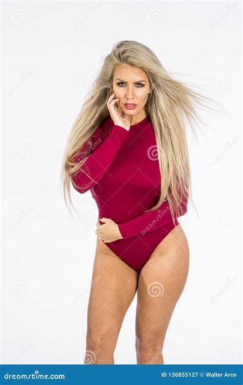 Beautiful Blonde Model Pointing And Showing Emotion While Posing In A