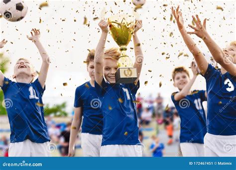 Champion Youth Soccer Team with Winning Trophy. Boys Football Team