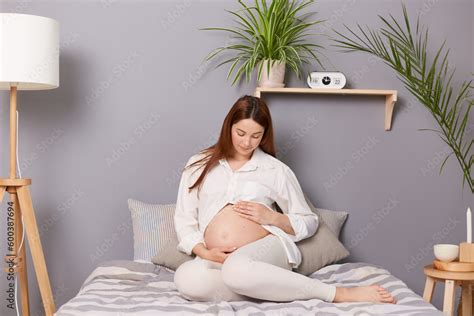 Cute Pregnant Brunette Dark Haired Woman With A Visible Belly Relaxing Awaited Her Baby