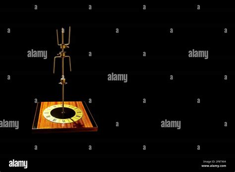 Abstract Object On Black Background Vintage Wall Clock With A Metal