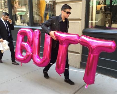 Guy Carrying A Hot Pink Butt Faxo