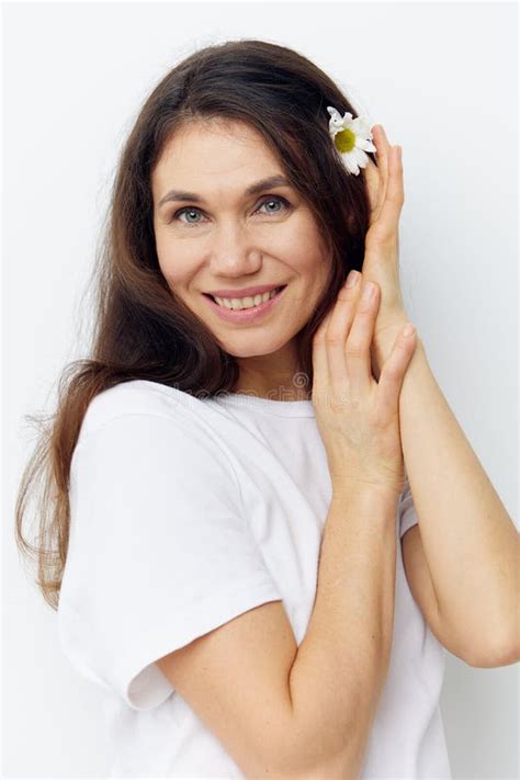 Portrait Of A Cute Happy Beautiful Brunette Woman In A White T Shirt Smiling Pleasantly