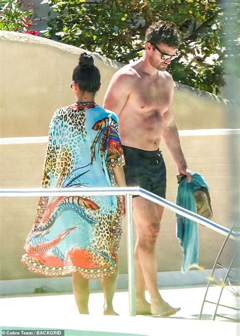 Nicole Scherzinger Puts On A Very Busty Display In A Skimpy Blue Bikini As She Relaxes Poolside