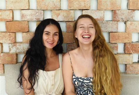 Premium Photo Ukrainian Woman Brunette And Russian Woman Blond Portrait Together With Long Hair