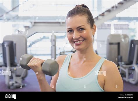 Fit Brunette Holding Grey Dumbbell Stock Photo Alamy