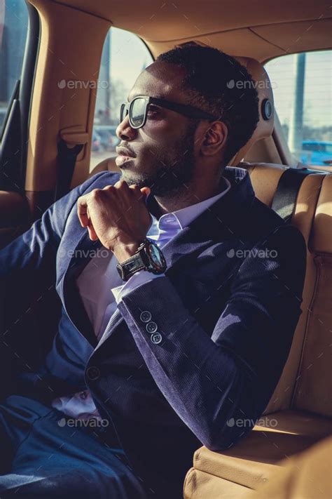 Stylish Black Man in Car: Fashionable and Sophisticated