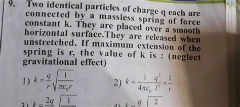 Two Identical Particles Of Charge Q Each Are Connected By A Mass Less