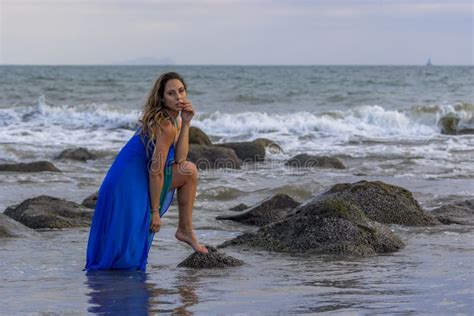 Lovely Brunette Latin Model Poses Outdoors On A Beach At Sunset Stock Photo Image Of Foam