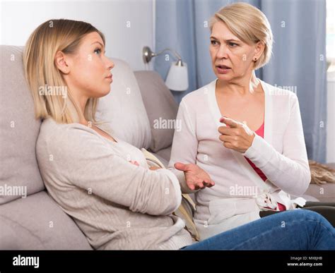 Angry Mother Scolds Her Adult Sad Daughter Stock Photo Alamy