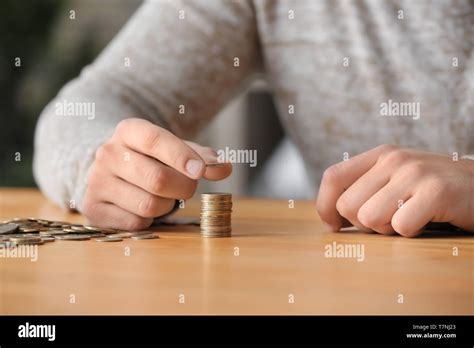 Man Counting His Savings At Table Stock Photo Alamy