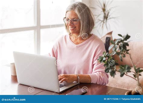 Happy Stylish Mature Old Woman Remote Working From Home Distance Office