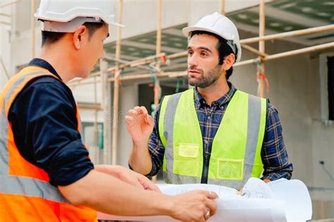 Civil Engineers Team With Safety Hard Hat Working Together At