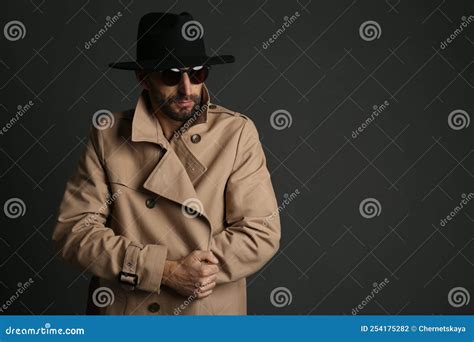 Exhibitionist Exposing Naked Body Under Coat On Black Background