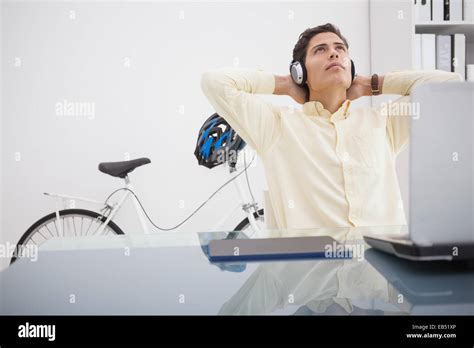 relaxed designer leaning    chair stock photo alamy