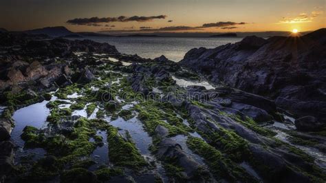 Sunset On Scenic Rocky Beach On West Coast Of Scotland Stock Image