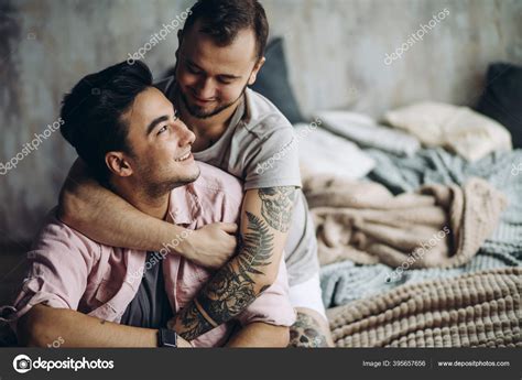 Two Sexy Caucasian Gay Guys Hugging And Having Fun In Bed Indoors