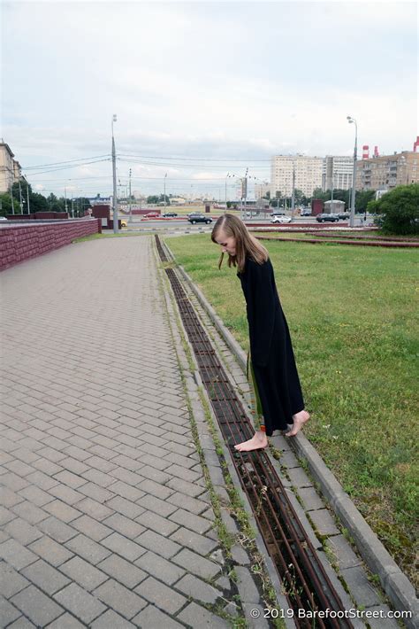 Mature Hippie Girl Olga Walks Barefoot In A Dirty City On A Rainy Day Part Of Barefoot