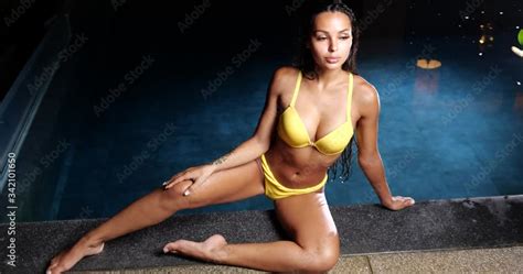 Sexy Woman In The Swimming Pool At Night Wearing Yellow Bikini Stock Video Adobe Stock
