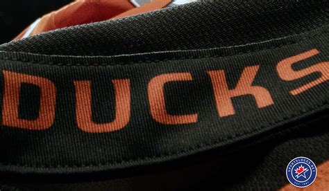 DUCKS HOCKEY Is In Orange On The Inside Back Collar