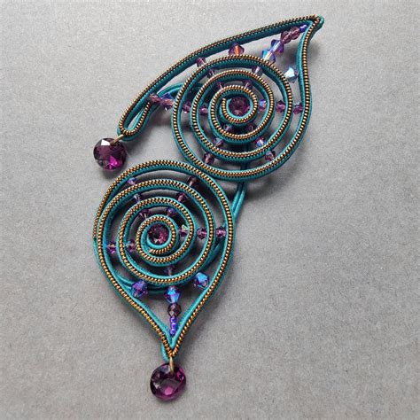 Украшение на ухо "На крыльях творчества"