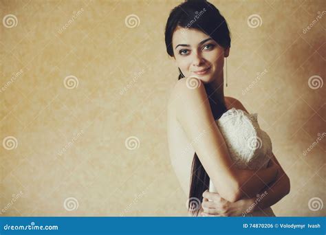Naked Bride Tries A Wedding Dress Stock Photo Image Of Bridesmaid Bright 74870206