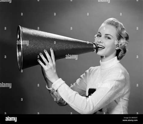 S Blonde Woman Cheerleader Yelling Into Megaphone Looking At Camera Stock Photo Alamy