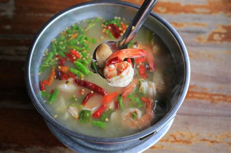 Spicy Shrimp Soup Or Tom Yum Goong Hot And Sour In Pot On Wood Table Thai Traditional Cuisine