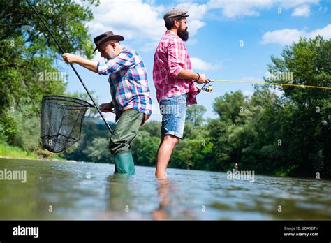 Portrait Of Two Men On Holiday Retired Dad And Mature Bearded Son Giving Your Hobby Weekends