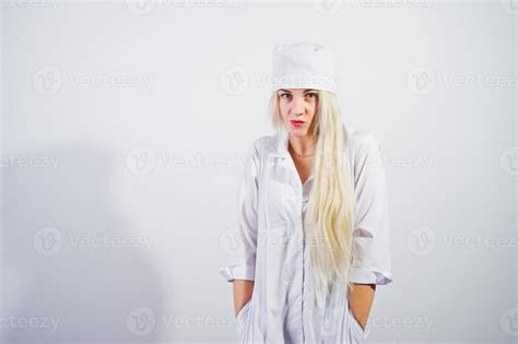 Attractive Blonde Female Doctor Or Nurse In Lab Coat Isolated On White Background 10565980