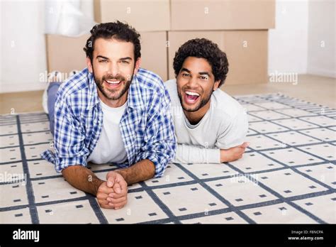 Happy Gay Couple Laying On Floor Stock Photo Alamy