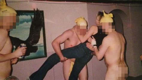 Shocking Photos Show Female RAF Recruit Being Grabbed And Tossed In The Air By Gang Of Naked