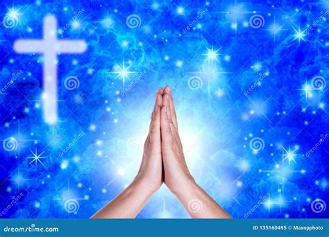 praying hands   blue sky  crucifix stock image image
