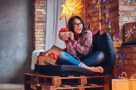 Free Photo Sexy Brunette Female With Naked Foot Dressed In A Jeans And A Red Sweater Posing On