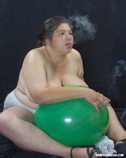Pretty Bbw Chick Naked And Smoking While Sitting On Balloons Photos