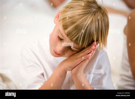 Close Up Of A Boy Pretending To Sleep Stock Photo Alamy