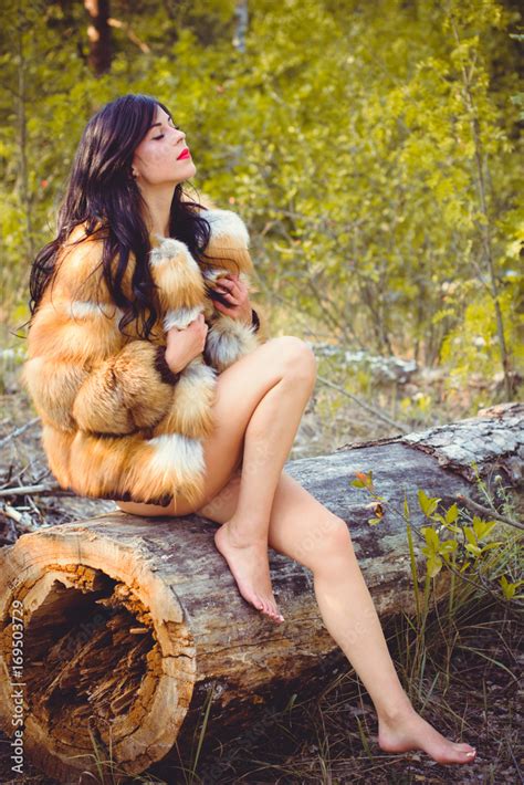 Luxurious Naked Lady In Fur Coat Made Of Fox Fur In The Forest Attractive Slender Brunette With