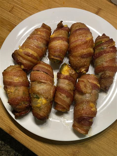 Sausage And Cheddar Stuffed Jalapeños Wrapped In Bacon Spicy