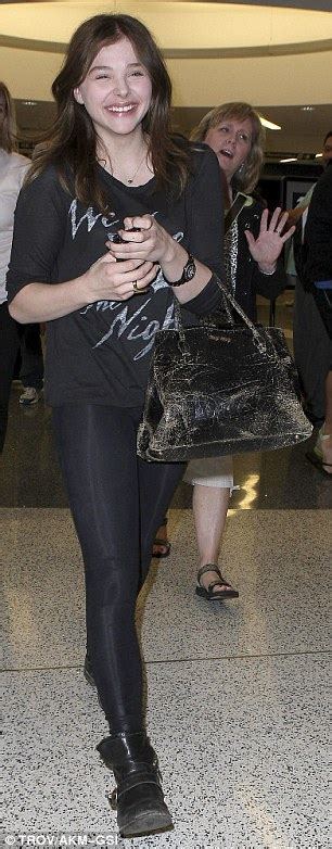 Chloe Moretz Travels To Los Angeles In Kick Ass Black Leggings And