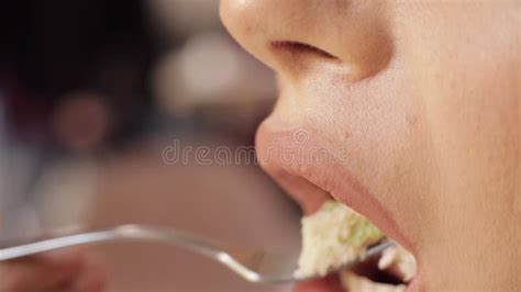 Female Lips With Nude Lipstick Licking By Tongue Eating Tasty Cake Extreme Close Up Stock Video