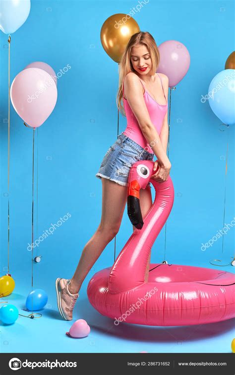 Shy Pretty Blonde Woman Standing On Tip Toes Looking Down Stock Photo Ufabizphoto