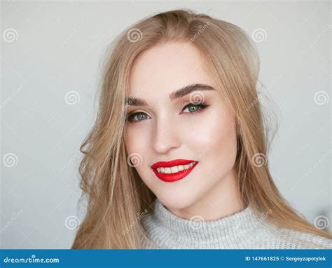 Closeup Natural Light Beauty Portrait Of Smiling Blonde Woman Model With Vibrant Saturated Red