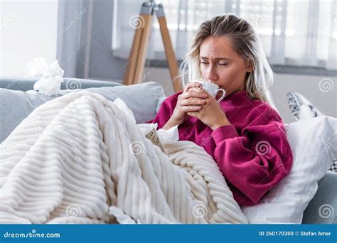 Cold And Flu Portrait Of Ill Woman Caught Cold Feeling Sick And Drinking Hot Bevarage Stock