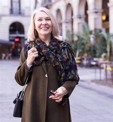 Portrait Of Smiling Mature Woman On Street Of Old European City Stock Photo Image Of Sunny