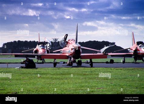 Two Red Arrow Pilots Discussing Next To There Aircraft Stock Photo Alamy