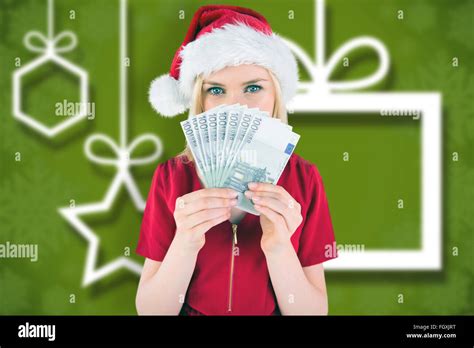 Composite Image Of Festive Blonde In Red Dress Showing Her Cash Stock Photo Alamy