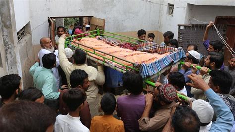 In Photos: Pakistan mourns deaths of 28 in train accident