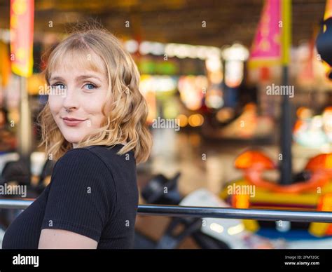 Blonde Spanish Woman Posing In The Amusement Park Stock Photo Alamy