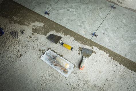 Laying Floor Ceramic Tile. Tools for Renovating Floor Stock Image ...