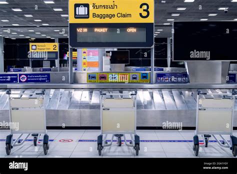 empty airport luggage trolleys or baggage carts at baggage claim aria ...