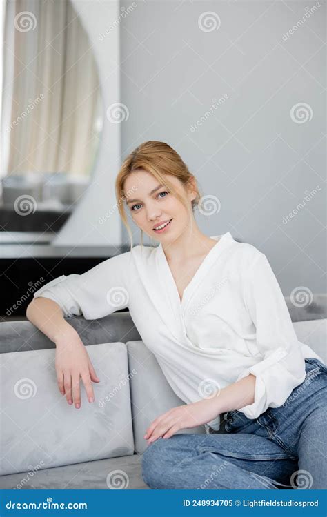 Portrait Of Smiling Blonde Woman Sitting Stock Image Image Of Positive Couch 248934705